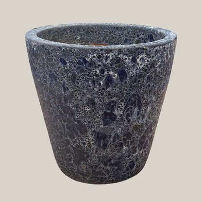 Blue coral tapered planter with wide tapered shape, textured blue-gray crackled finish, slightly angled view highlighting stone-like surface detail