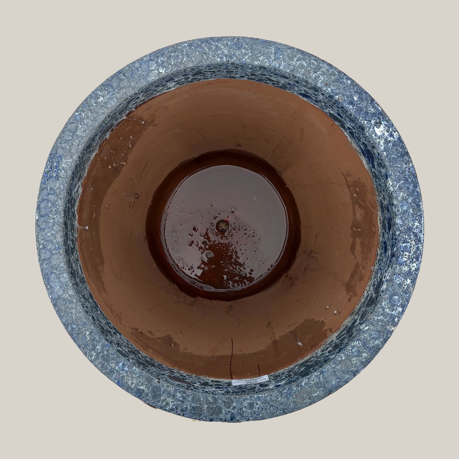 Top view of blue coral tapered planter showing wide circular opening and interior finish with subtle textured glaze