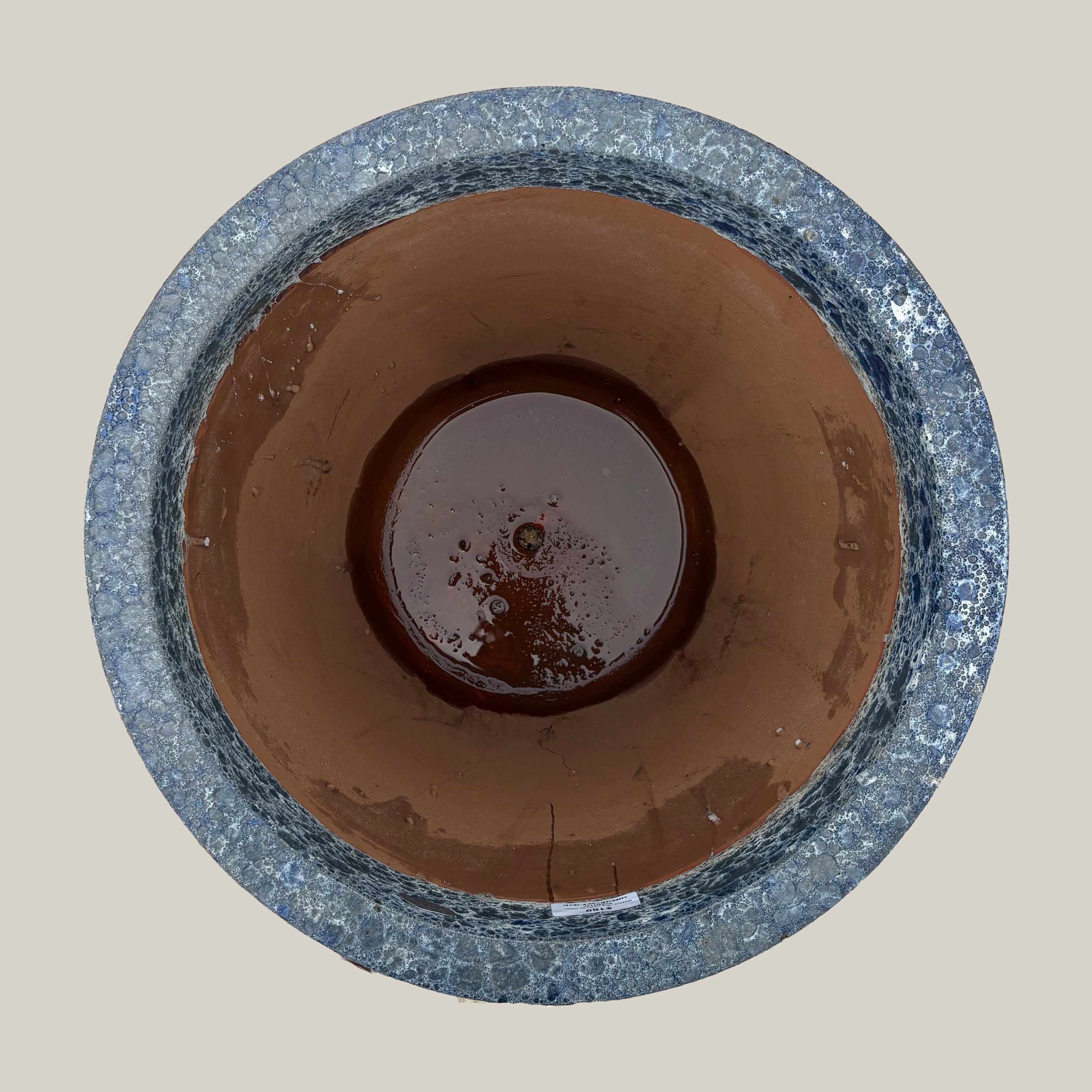 Top view of blue coral tapered planter showing wide circular opening and interior finish with subtle textured glaze