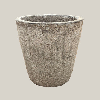 Gray coral tapered planter with rounded egg-shaped form and textured stone-like gray finish, slightly angled view highlighting natural surface