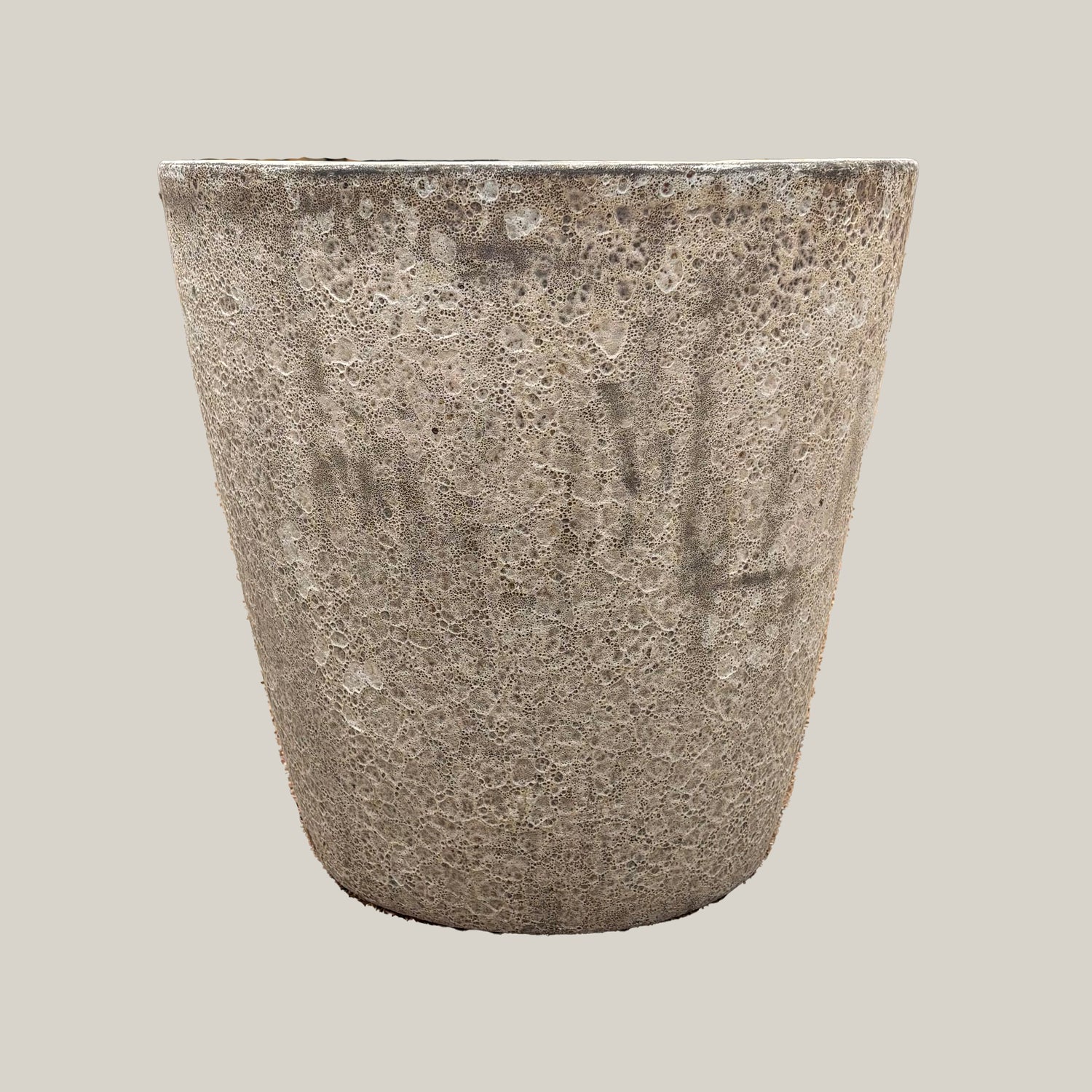 Front view of gray coral tapered planter with smooth rounded silhouette and rustic textured finish