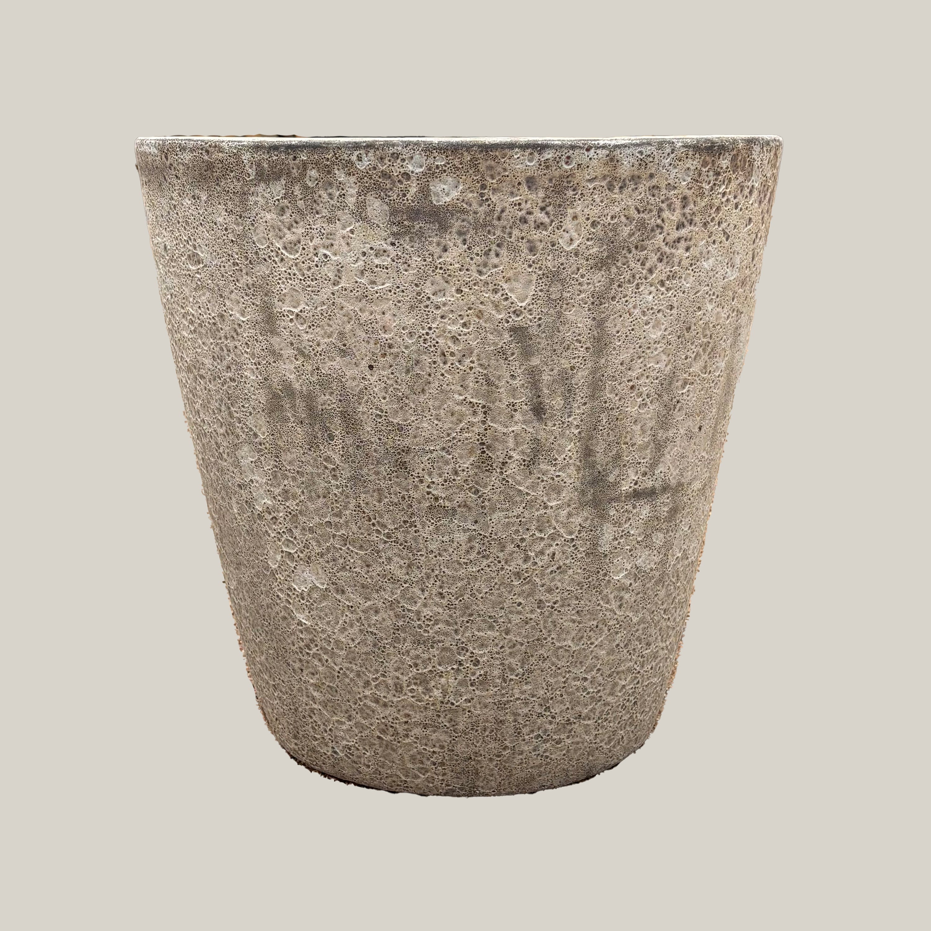 Front view of gray coral tapered planter with smooth rounded silhouette and rustic textured finish