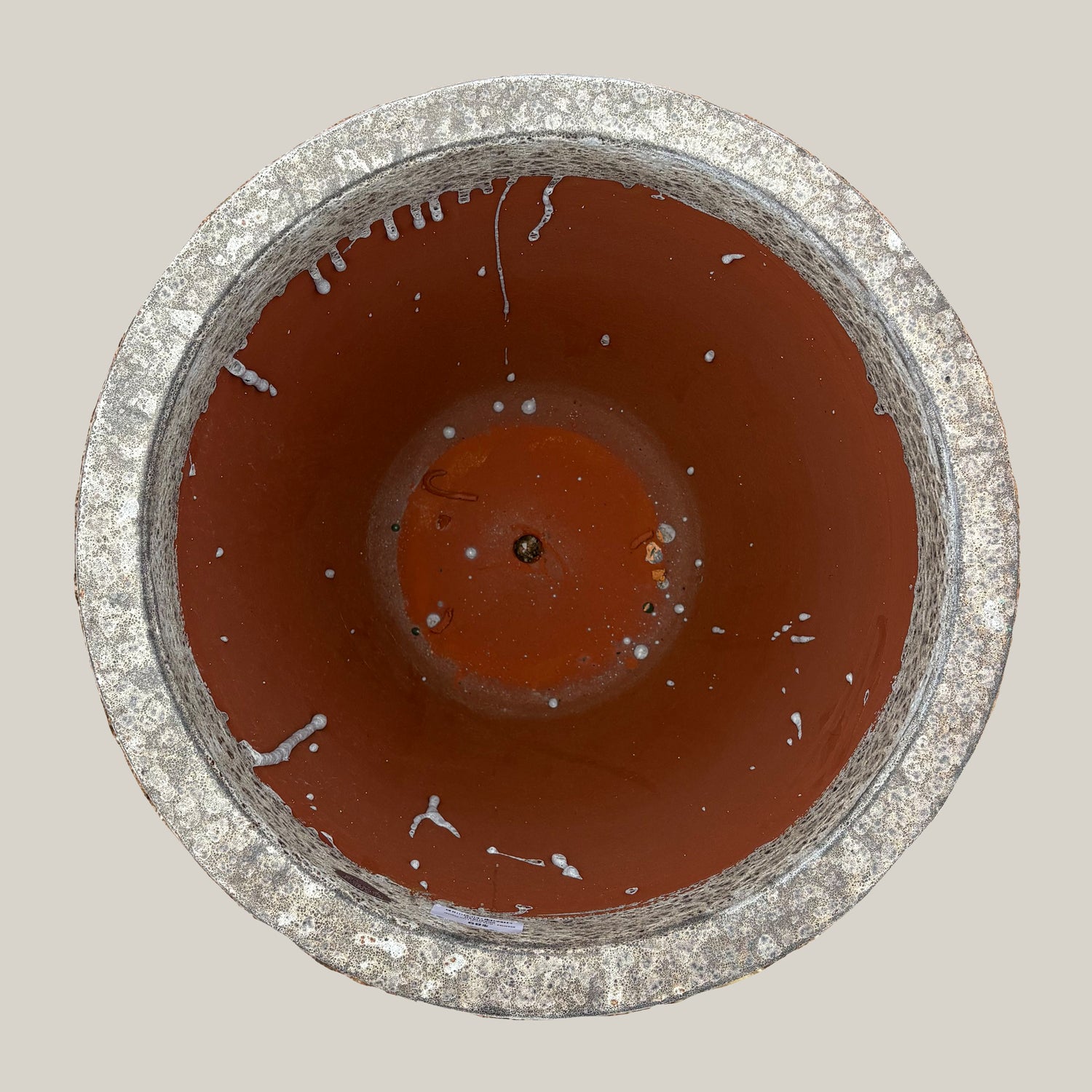 Top view of gray coral tapered planter showing wide circular opening and earthy stone-like interior texture