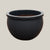 Matte black round bowl planter with wide low-profile silhouette, slightly angled view highlighting its smooth matte finish