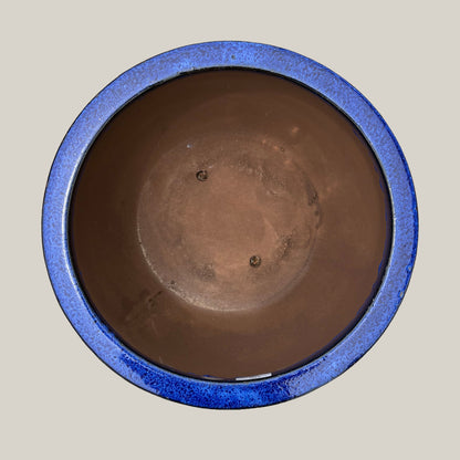 Top view of blue round bowl planter showing its wide opening and rounded bowl design