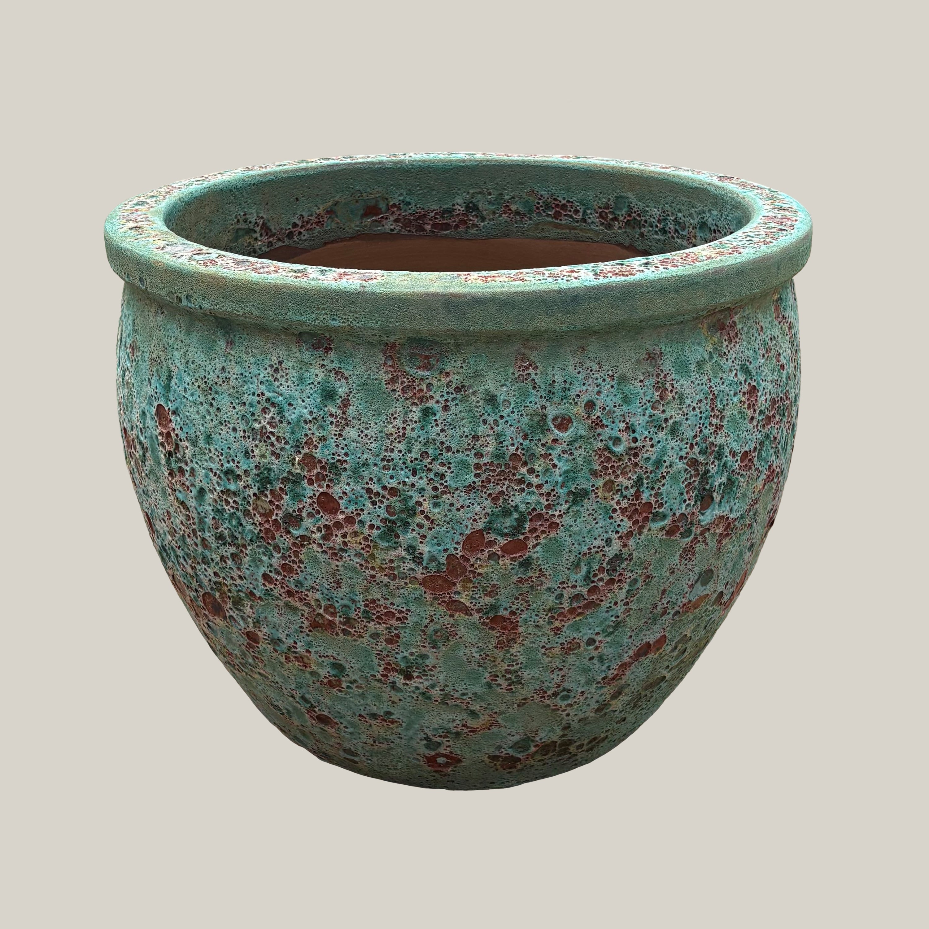 Turquoise coral round low bowl planter with textured glazed finish, slightly angled view