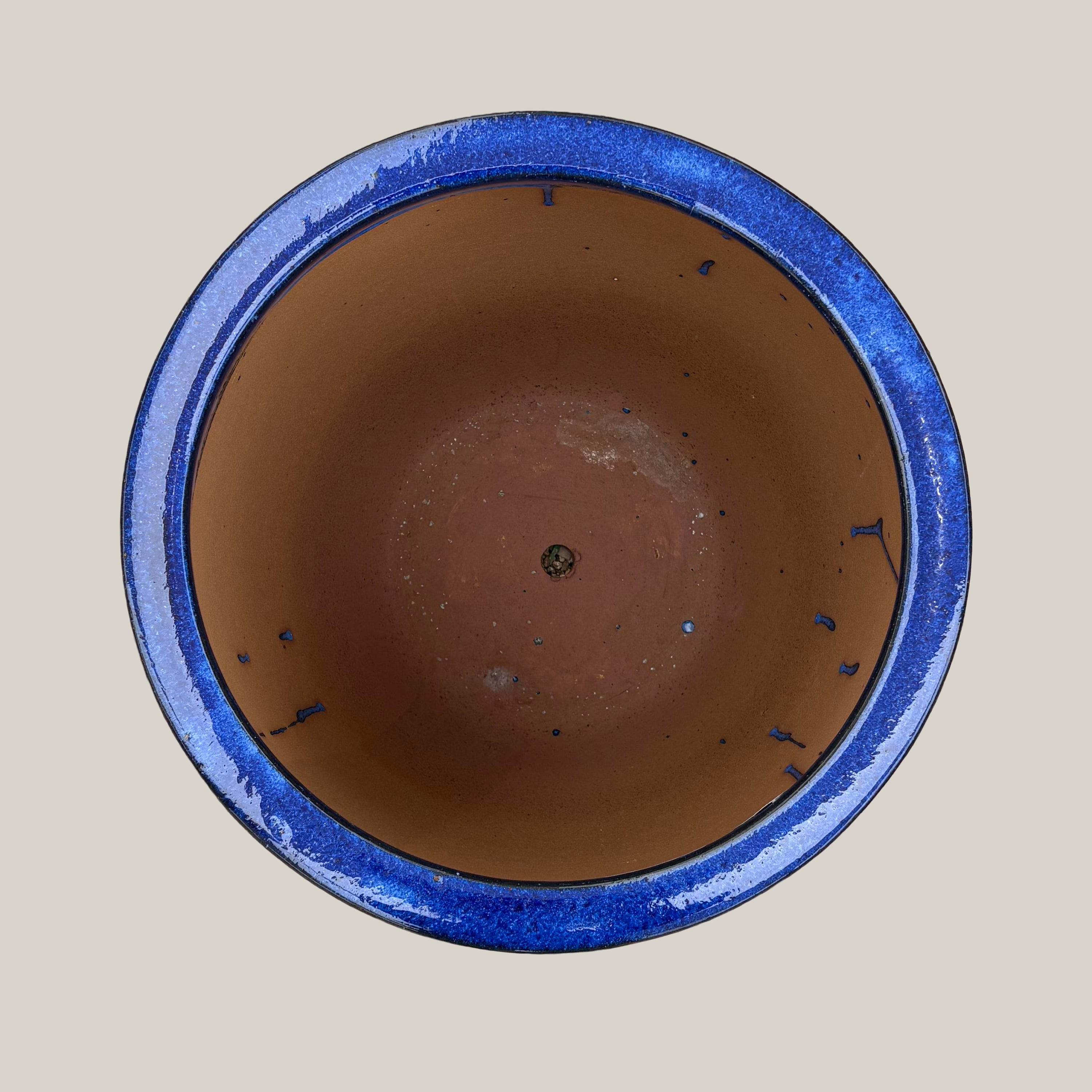 Top view of blue belly planter showing wide circular opening and deep interior bowl form