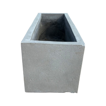 Top-down view of low grey rectangular fiberstone planter, emphasizing its rectangular opening and compact, streamlined proportions.