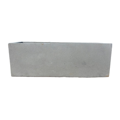 Side profile of low grey rectangular fiberstone planter, showing its slim height and elongated rectangular structure.