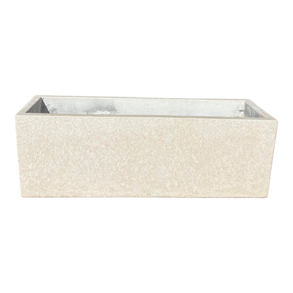 10" &amp; 14" low white rectangular fiberstone planter shown from the front with a slight top angle, highlighting its low-profile rectangular form and stone-look finish.