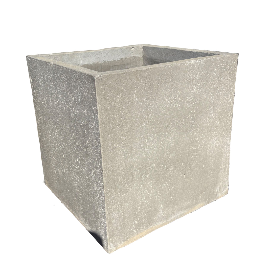 Grey cube fiberstone planter viewed from an angled corner, showing two sides of its balanced cube form and subtle stone texture.