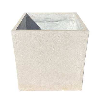 Grey cube fiberstone planter shown from the front with a slight top angle, highlighting its clean cube shape and modern stone-look finish.