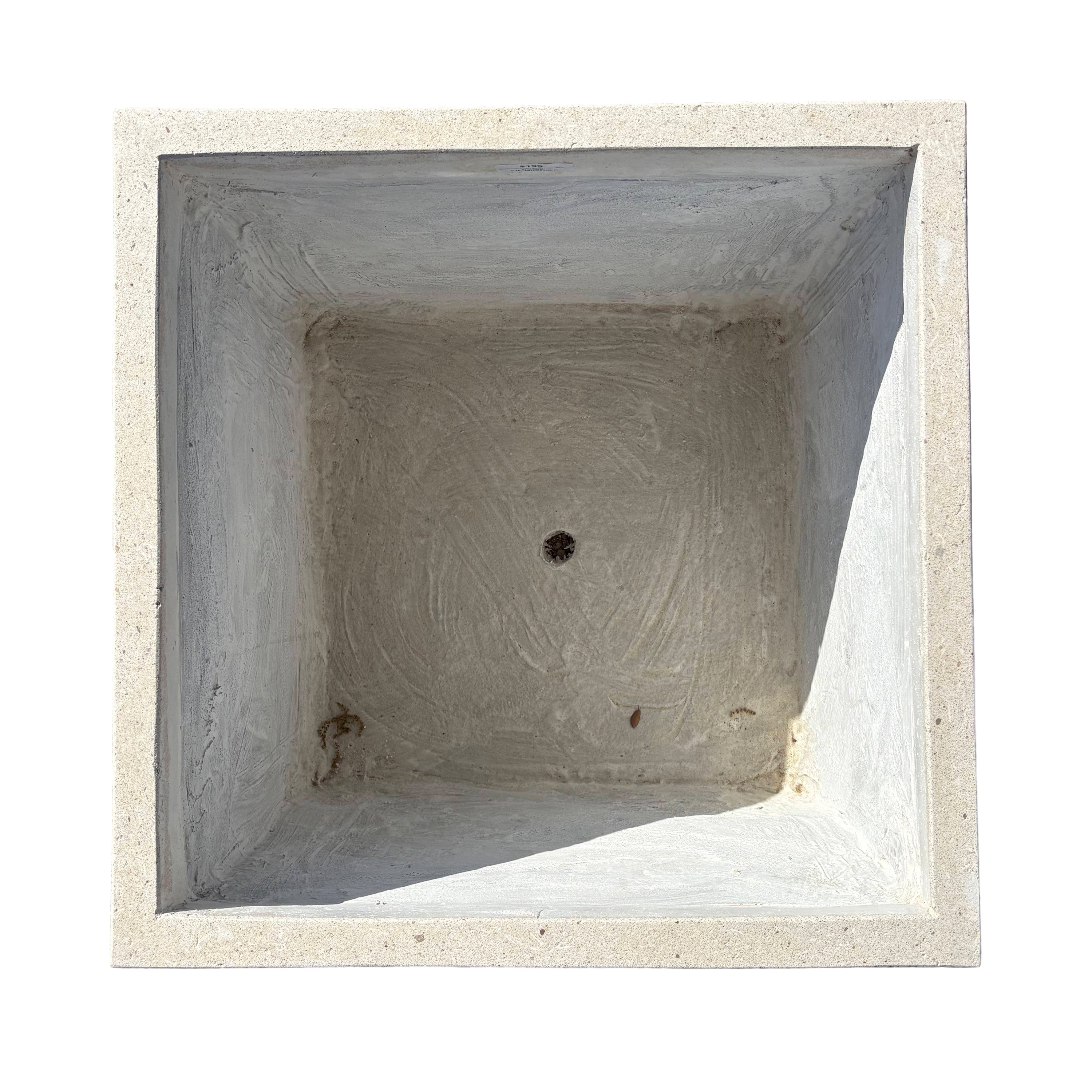 Top-down view of grey cube fiberstone planter, emphasizing its square opening and symmetrical proportions.