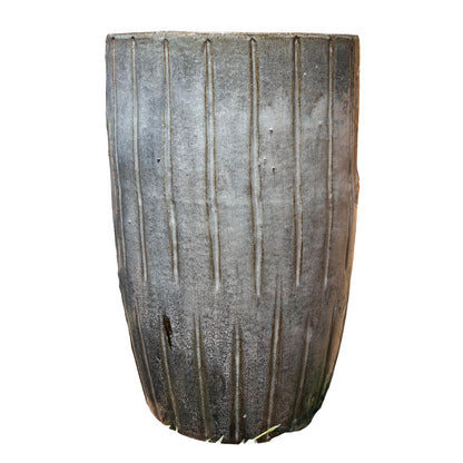Front view of tall fluted grey ceramic planter with vertical ribbed texture and tapered profile
