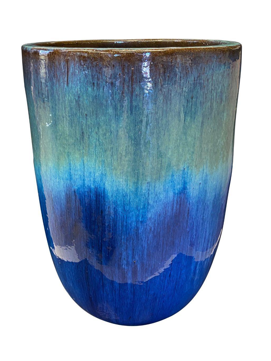 Image of a blue and brown modern cylinder planter.
