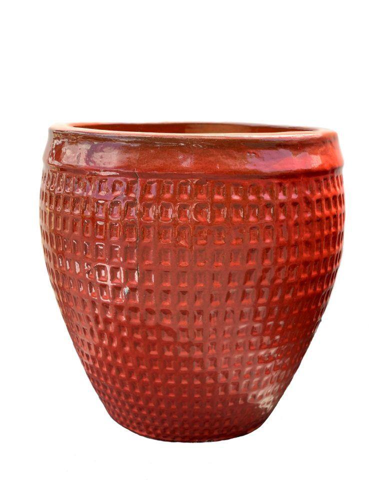 Large red ceramic planter with wide rim and waffle-style design