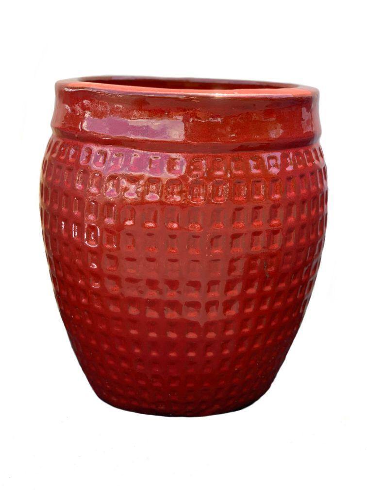 Large red ceramic planter with wide rim and waffle-style design