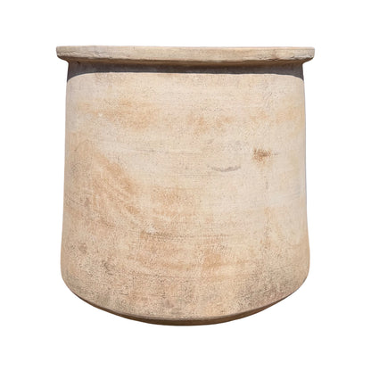 A large cylindrical ceramic planter, featuring a textured, rustic finish in warm beige and light brown tones, isolated on a white background.