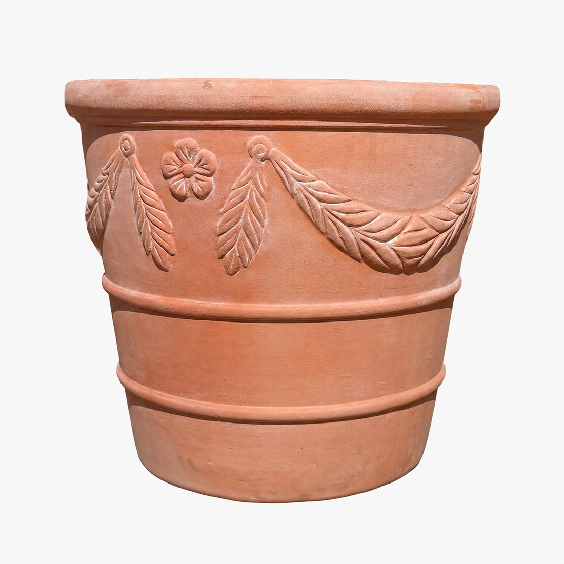 A terracotta clay pot with carved decorative leaf and garland motifs around the upper band, shown on a plain light gray background.