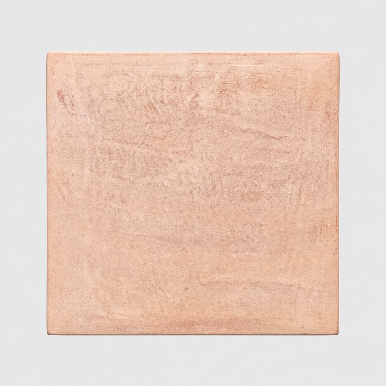 A square terracotta planter with a textured, matte finish in a warm peachy-pink color, shown against a neutral light gray background.
