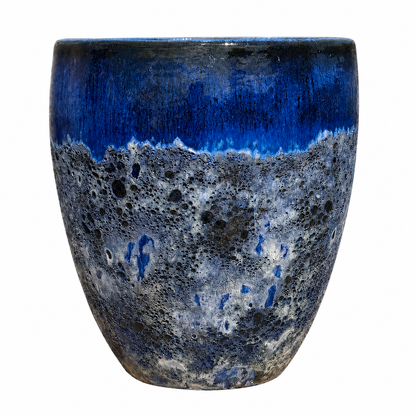 A ceramic planter with a textured, porous glaze featuring a vibrant blue top section and a mottled blue, gray, and black lower body, shown against a plain white background.