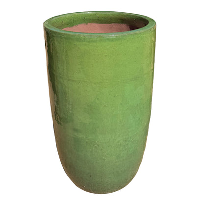 A tall, cylindrical green glazed ceramic planter, shown against a plain white background.