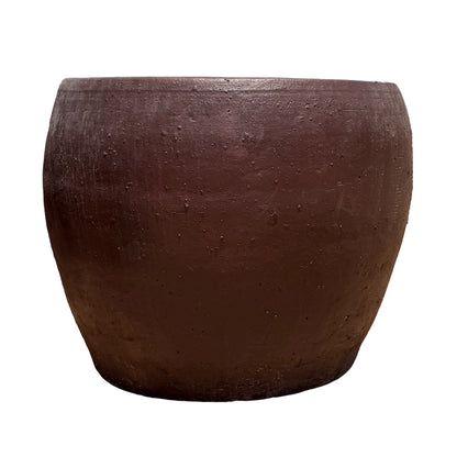 Front view of a large, round, brown textured clay planter on a solid white background.