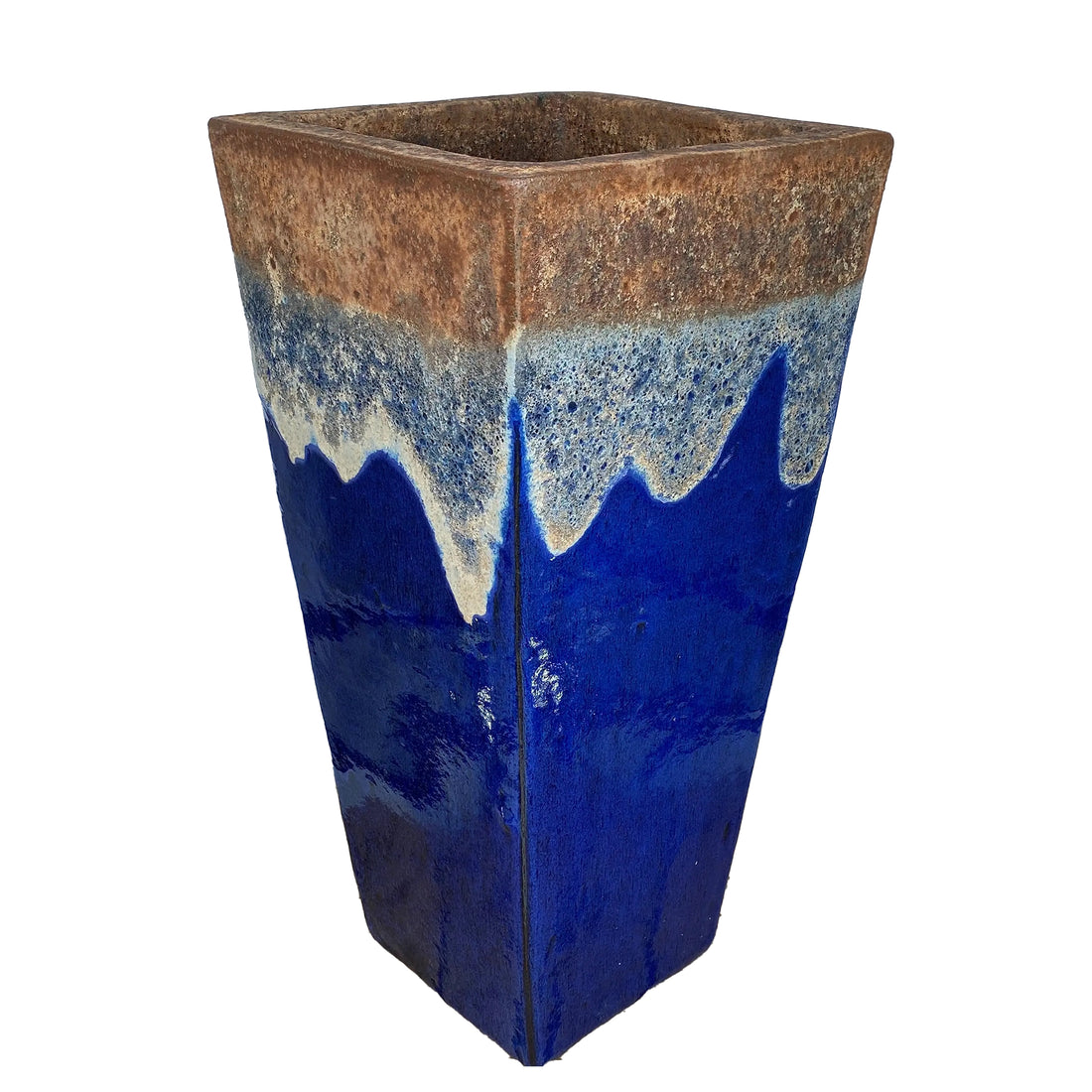 Angkor and Blue wedge planter at an angle, with a rusty copper rim and cream drips flowing into glossy cobalt blue.