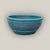 Antique Aqua rustic low bowl ceramic planter, slightly angled from above to show its rolled rim, raised rings, and aqua glaze.