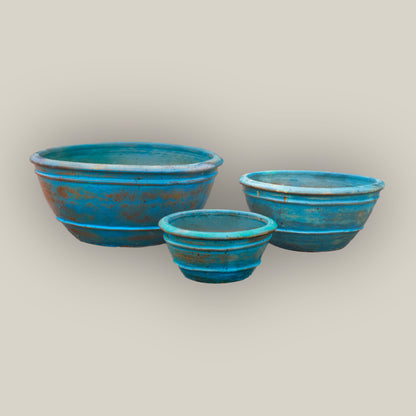 Three antique aqua low-bowl planters, slightly angled from above, with the large bowl left, the medium right, and the small in front.