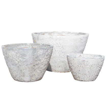 The Atlantis White Rustic Giant Cone Ceramic Planter in three sizes side by side, showing off that same softly weathered white cone silhouette scaled from compact to statement-making.