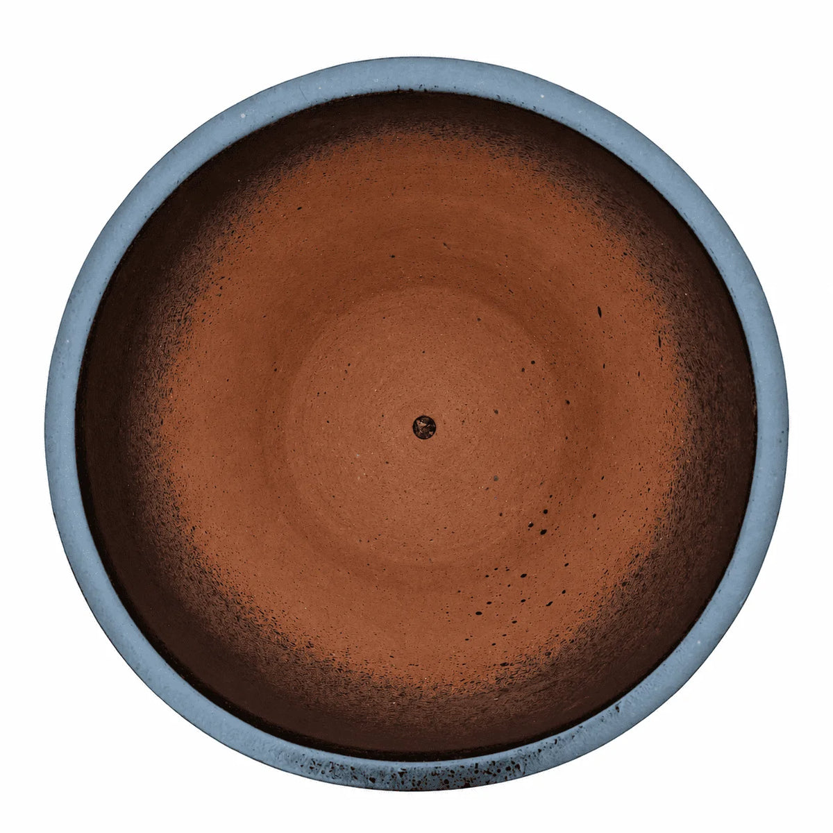 Top-down view of a black tapered round ceramic planter, with dark speckled inner walls that fade into a terracotta-red floor around a small central drainage hole