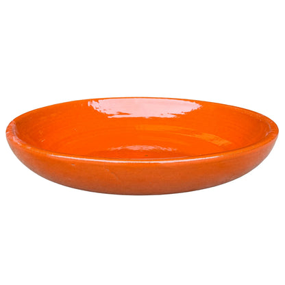 Atomic Orange ceramic bird bath bowl, slightly angled from above to show its shallow, glossy basin and smooth rounded rim.