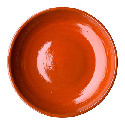 Top-down view of an Atomic Orange ceramic bird bath bowl, showing a wide, glossy basin in solid bright orange with faint throwing rings.