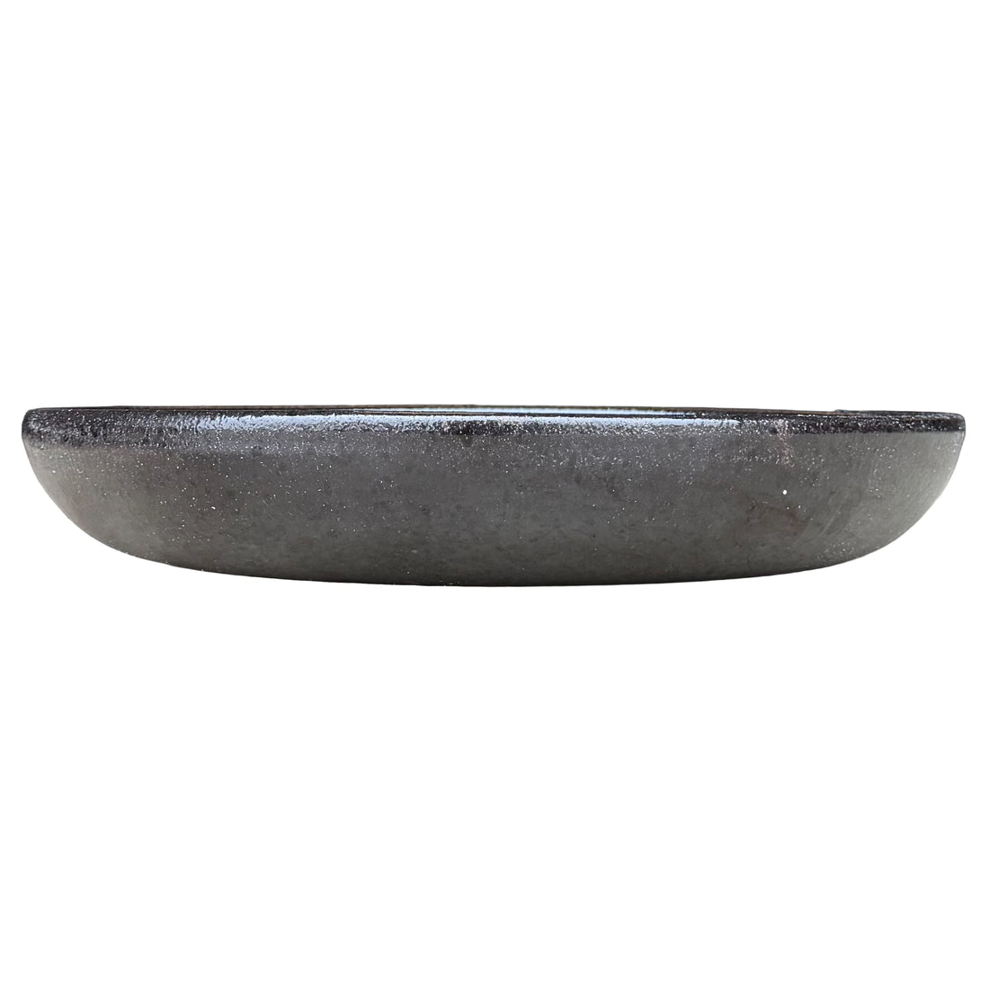Eye-level front view of a shallow black bird bath bowl, with a low rounded profile and a satin charcoal exterior with fine sparkle.