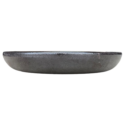 Eye-level front view of a shallow black bird bath bowl, with a low rounded profile and a satin charcoal exterior with fine sparkle.