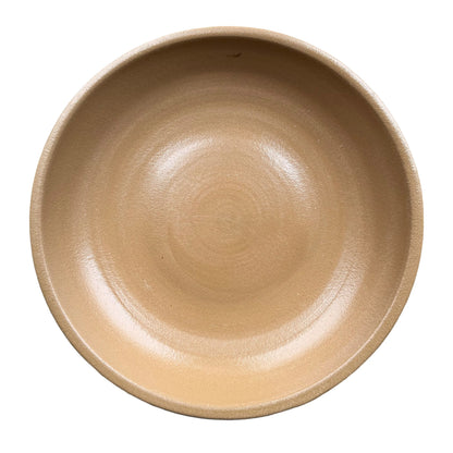 Top-down view of a Yellow Spray ceramic bird bath bowl, showing a wide sandy tan basin with a satin finish and faint throwing rim.