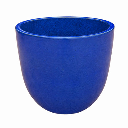 Angled view of a blue tapered round planter, showing its smooth, rounded egg shape, a glossy cobalt-blue finish, and a blue-glazed interior below the rim
