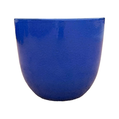 Front view of a blue tapered round planter with a rounded, gently tapering body in glossy royal-blue glaze, finished with fine dark speckles