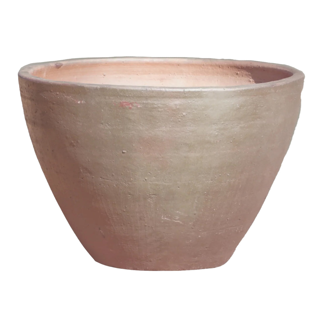 An Iron Clay Giant Cone Ceramic Planter tilted forward to show off its warm blush-pink interior, wrapped in a smooth, earthy clay exterior with subtle rust and taupe undertones.