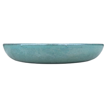 Eye-level front view of a jade ceramic succulent bowl, with a low, shallow profile and a glossy blue-green glaze with fine dark specks.