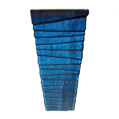Front view of a tall ribbed square planter with a turquoise-to-cobalt blue glaze darkening to brown along the rim.