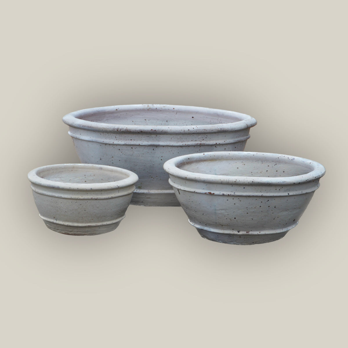 Three Matte White low bowl planters, slightly angled, with the large bowl in back, the small at front left, and the medium at front right.