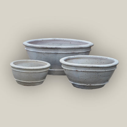 Three Matte White low bowl planters, slightly angled, with the large bowl in back, the small at front left, and the medium at front right.