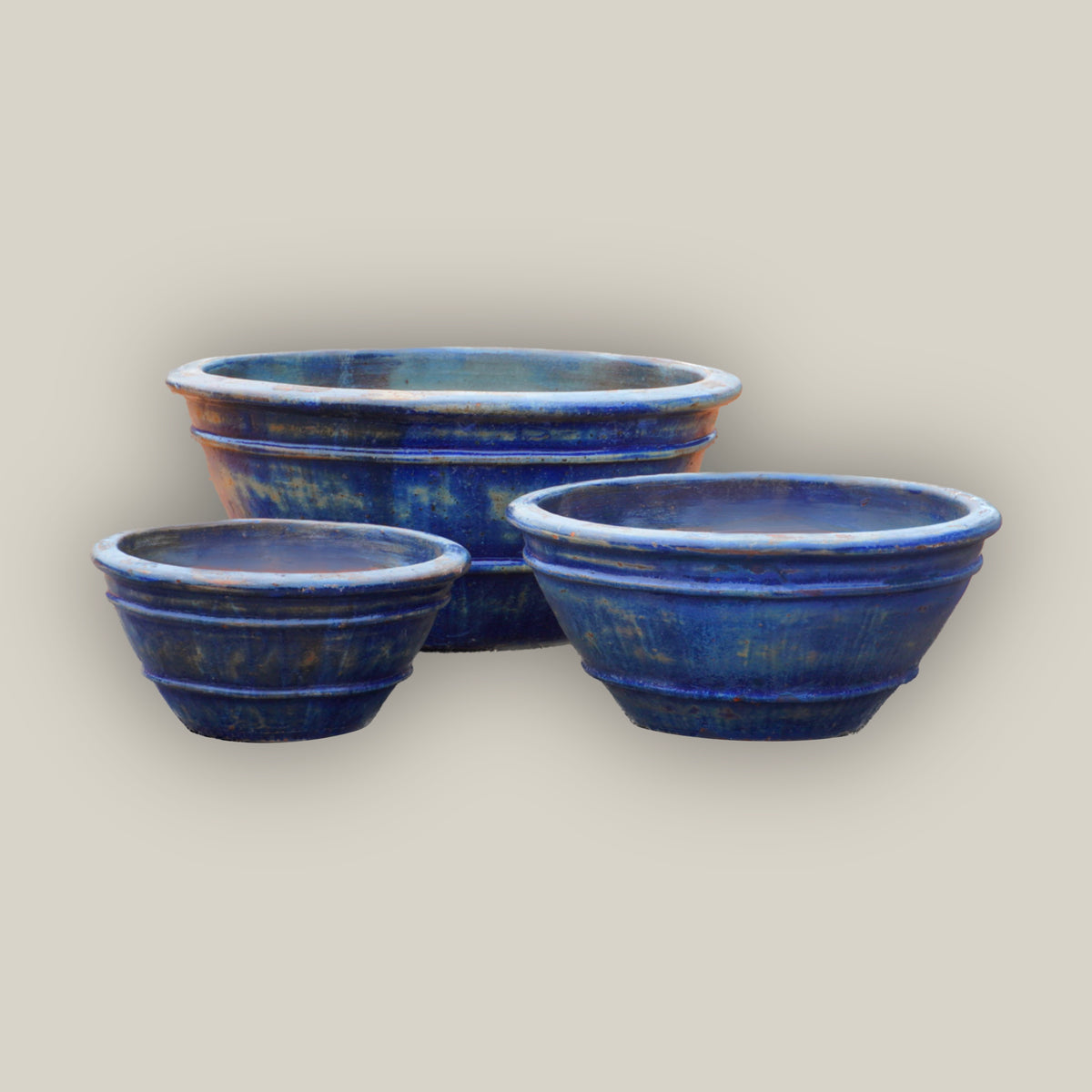 Three Midnight Blue low bowl planters, slightly angled, with the large bowl in back, the small at front left, and the medium at front right.