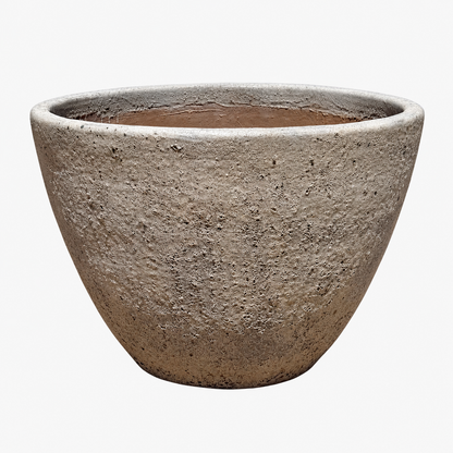 Oceanic White Giant Cone Ceramic Planter, angled front view revealing a smooth terracotta-lined interior, a tapered cone silhouette, a rounded rim, and a softly weathered, white stone-textured exterior.