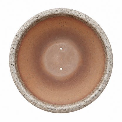 Oceanic White Giant Cone Ceramic Planter, top-down view showing the wide terracotta interior with drainage holes, framed by a thick rounded rim and weathered white stone exterior.