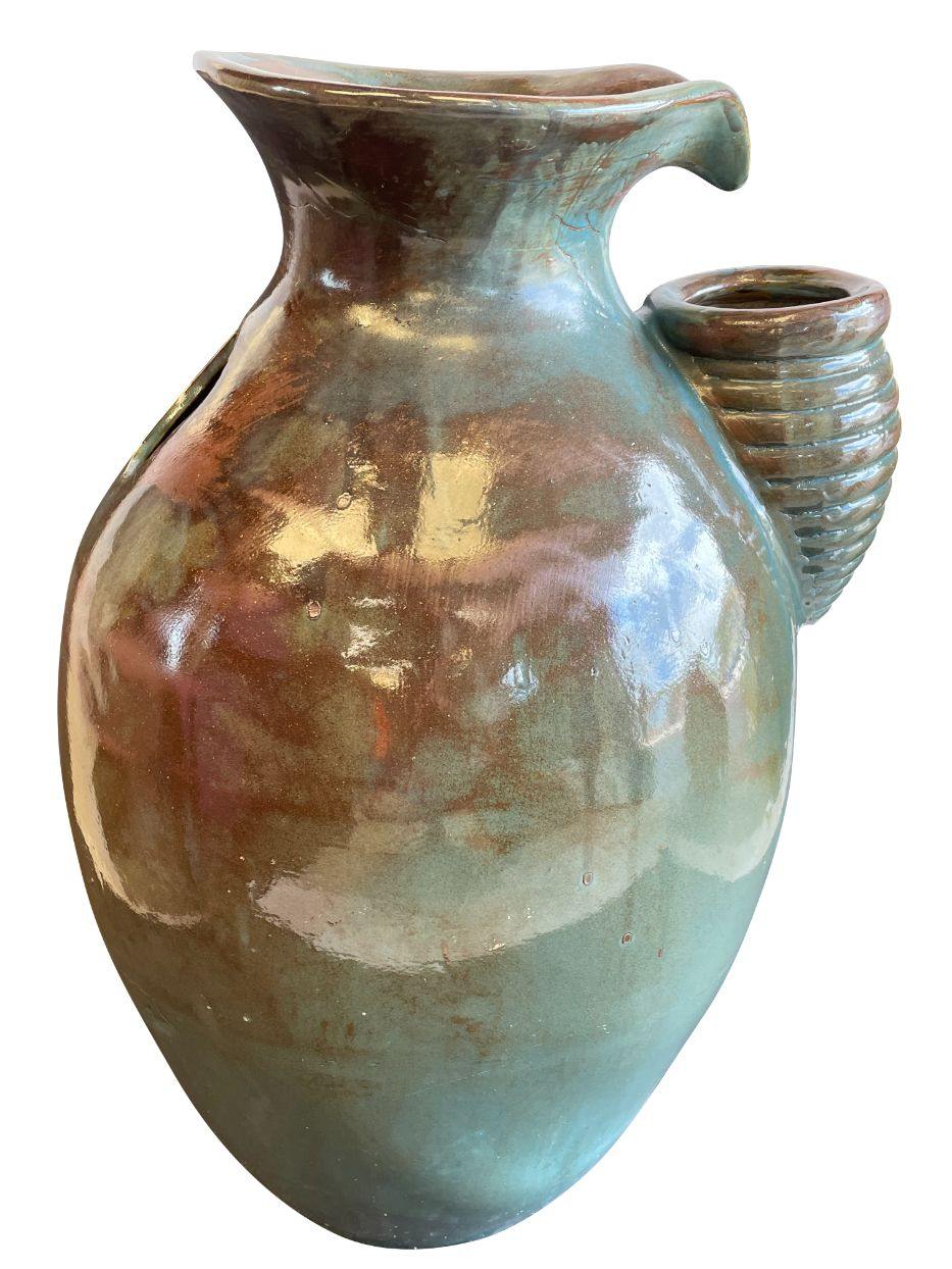 Image of an antique aqua self contained pouring fountain.