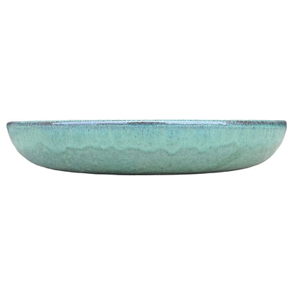 Front view of a low, rounded teal ceramic succulent bowl in sea-green glaze, with a soft wavy drip line around the middle and a speckled rim