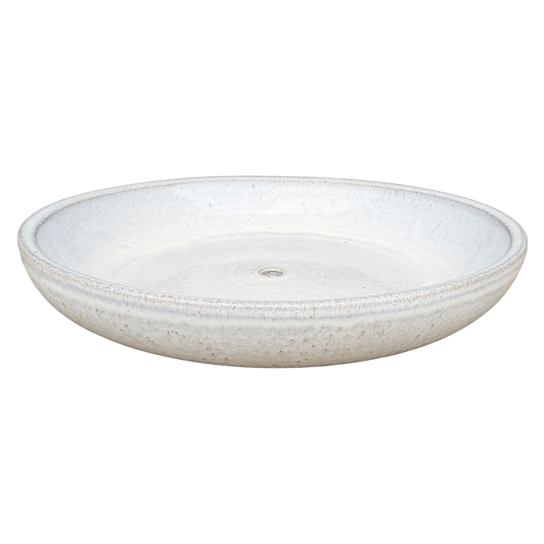 White ceramic succulent bowl viewed at an angle, showing a shallow speckled glaze interior, rounded rim and central drainage hole